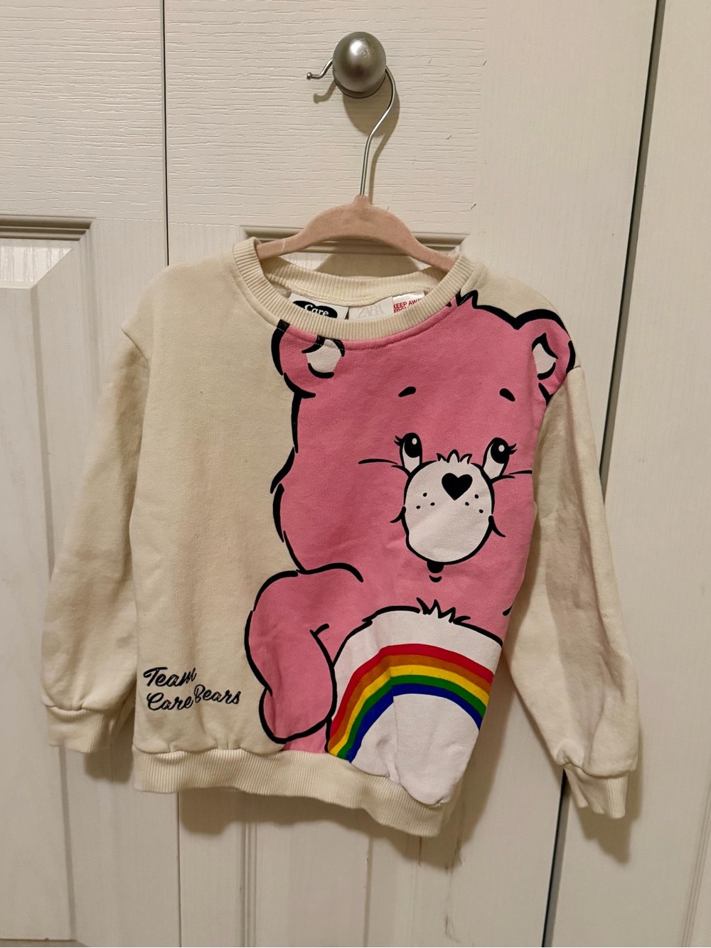 Care Bears Cream & Pink Crewneck Sweatshirt with Rainbow Graphic